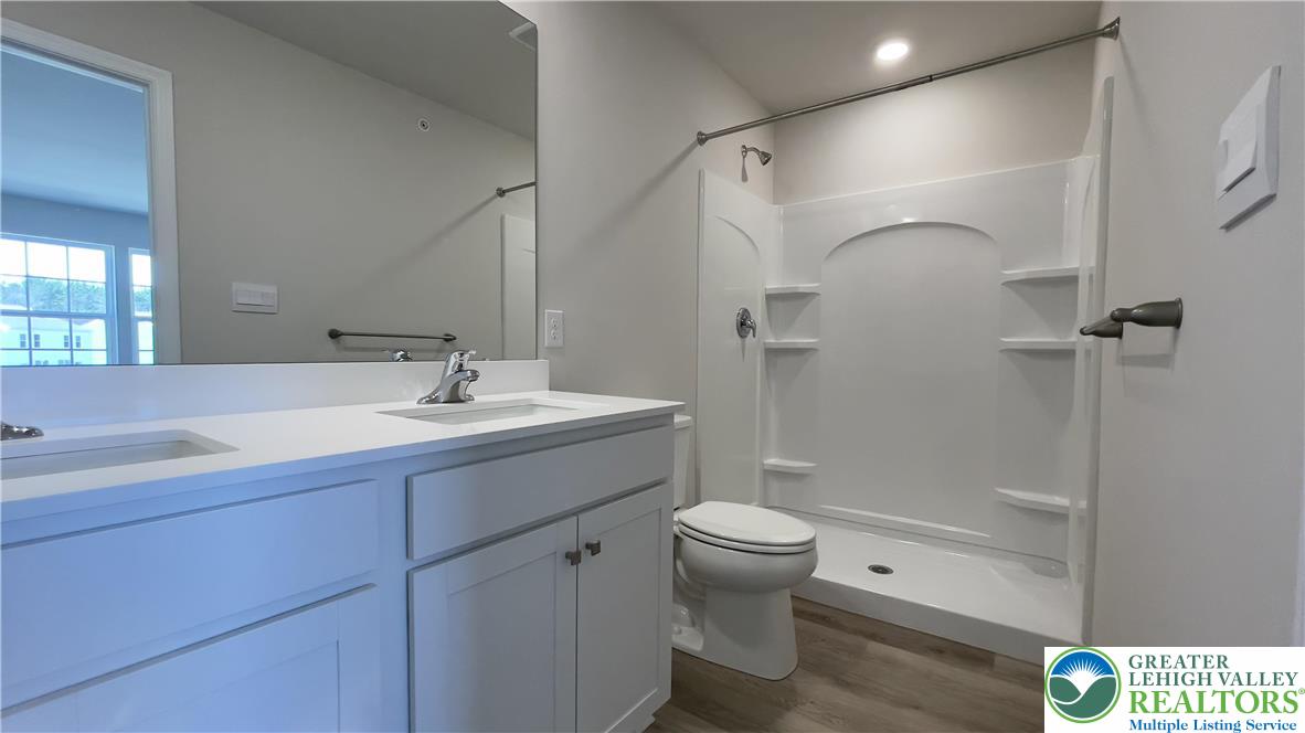 1248 Martin Road Breinigsville, PA 18031 - Photo 22 of 37 a bathroom with a sink a toilet and shower