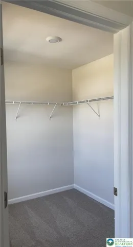 a view of a room with racks on the wall