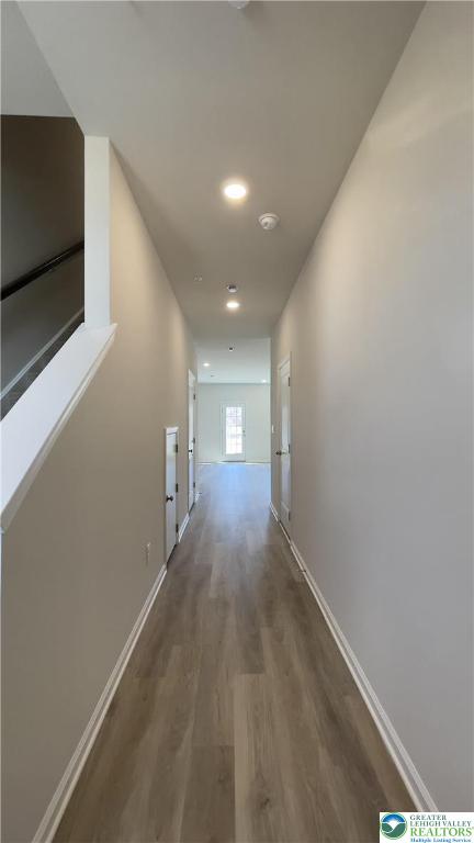 1248 Martin Road Breinigsville, PA 18031 - Photo 36 of 37 a view of a hallway with wooden floor and a flat screen tv