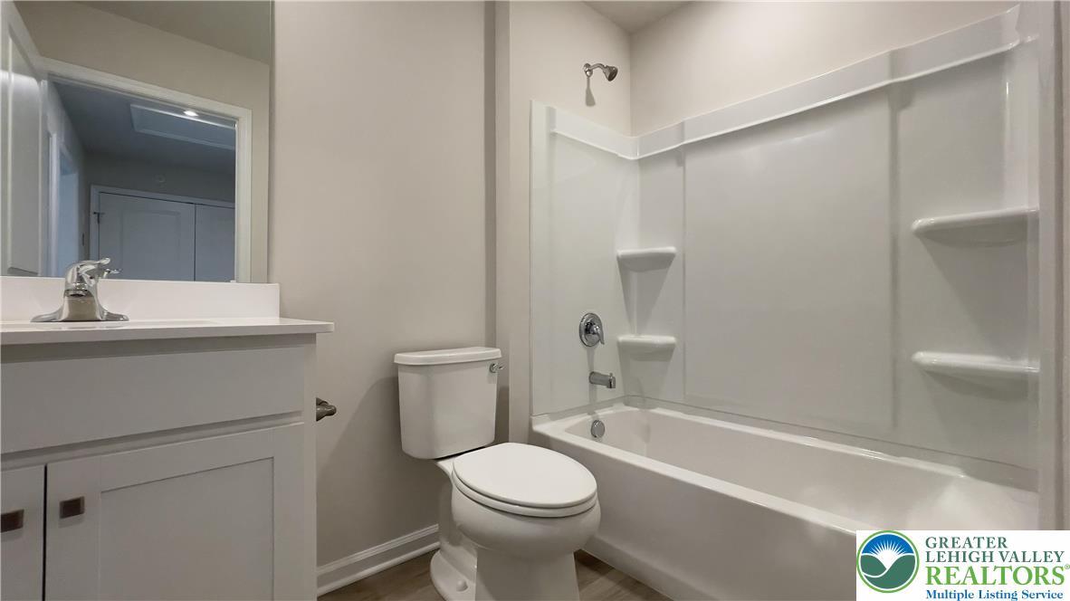 1248 Martin Road Breinigsville, PA 18031 - Photo 7 of 37 a bathroom with a sink a toilet and shower