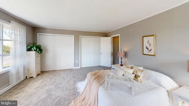 a bathroom with a sink toilet a mirror and shower