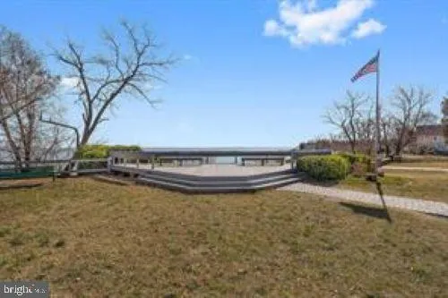 a view of lake and trees in the background