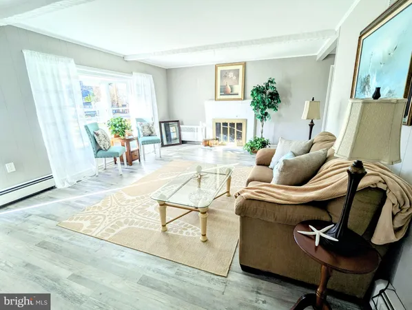 a kitchen with sink refrigerator and dining table