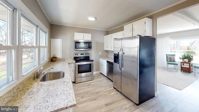 a kitchen with sink and window