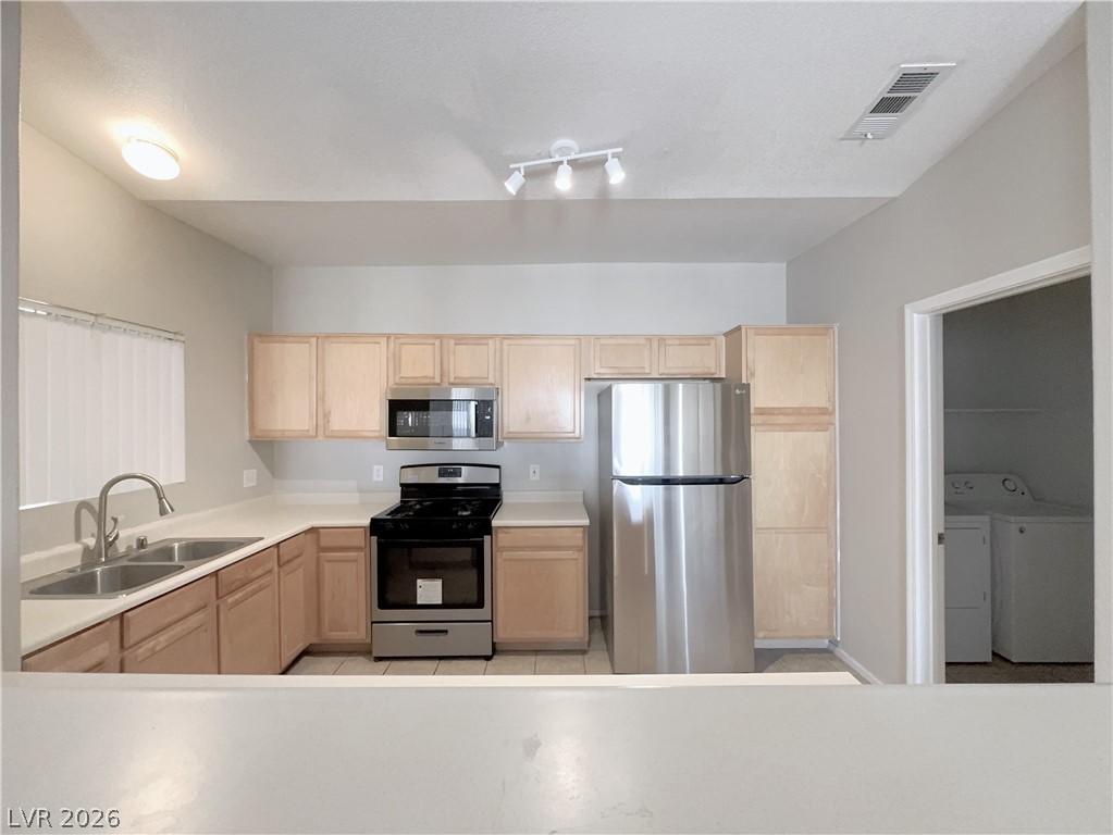 8725 West Flamingo Road, Unit 208 Las Vegas, NV 89147 - Photo 5 of 16 This functional kitchen features ample cabinetry and modern appliances, ready for culinary endeavors.