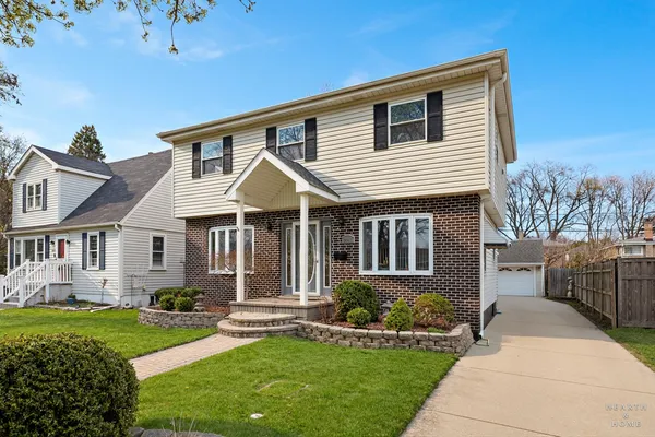 front view of a house with a yard