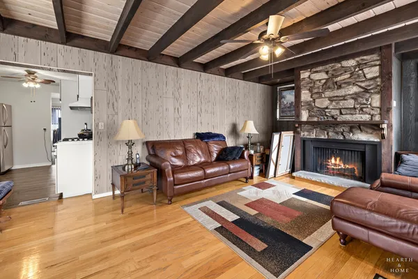 a living room with furniture and a fireplace