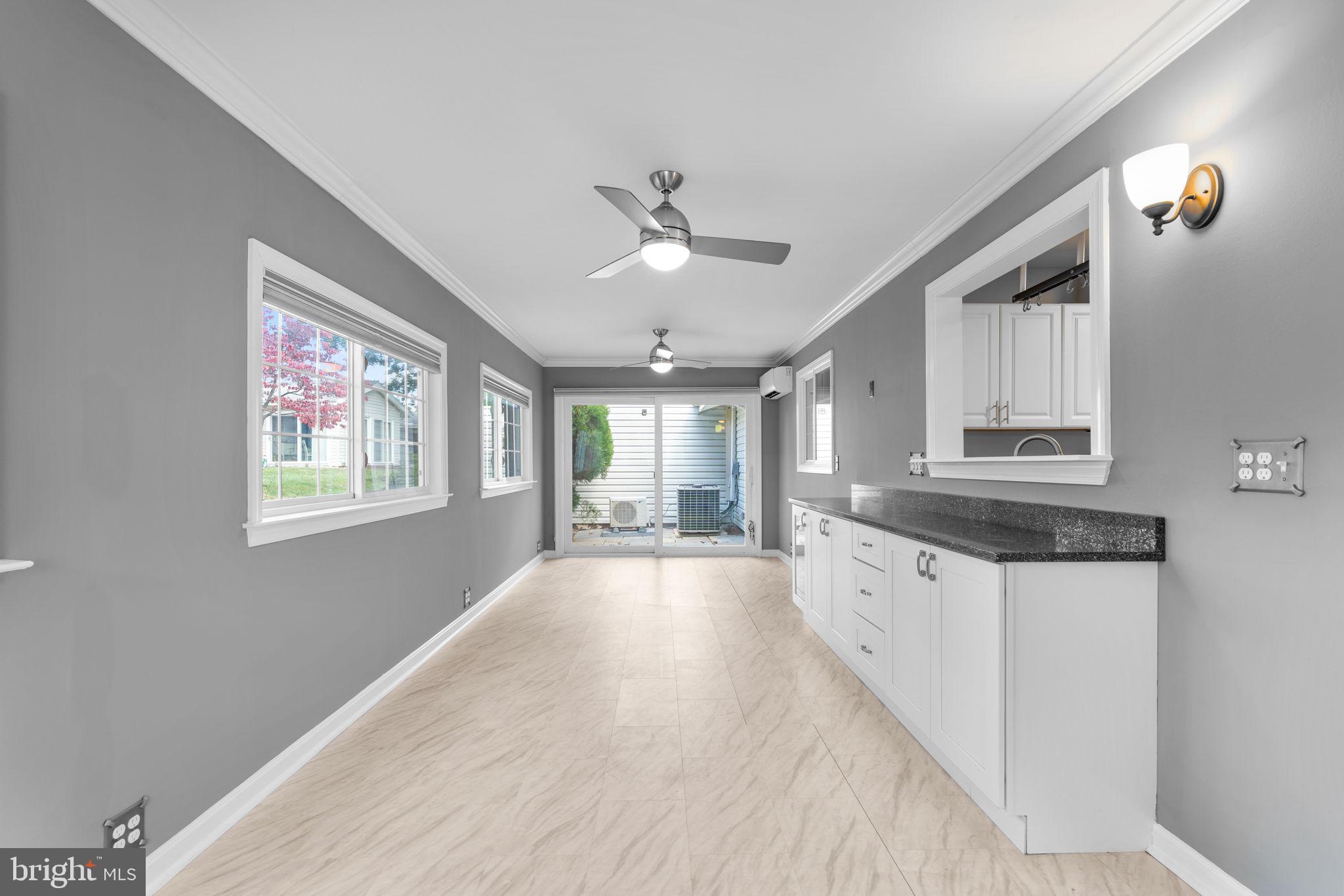 3415 Island Creek Court, Unit 131A Silver Spring, MD 20906 - Photo 12 of 32 a large kitchen with granite countertop a large window in it