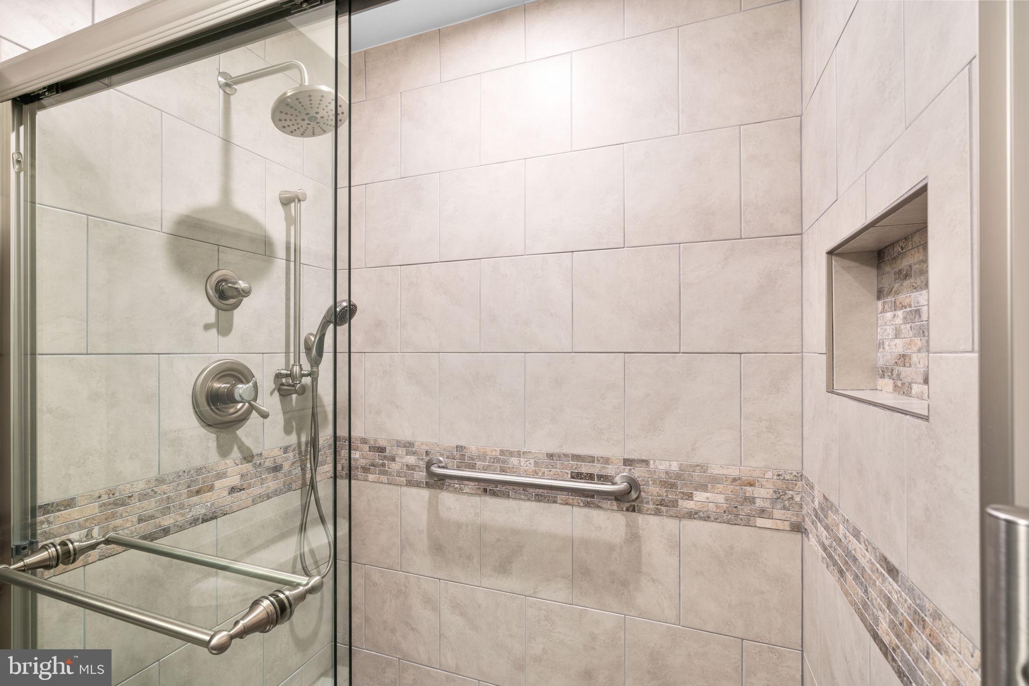 3415 Island Creek Court, Unit 131A Silver Spring, MD 20906 - Photo 24 of 32 a bathroom with a shower