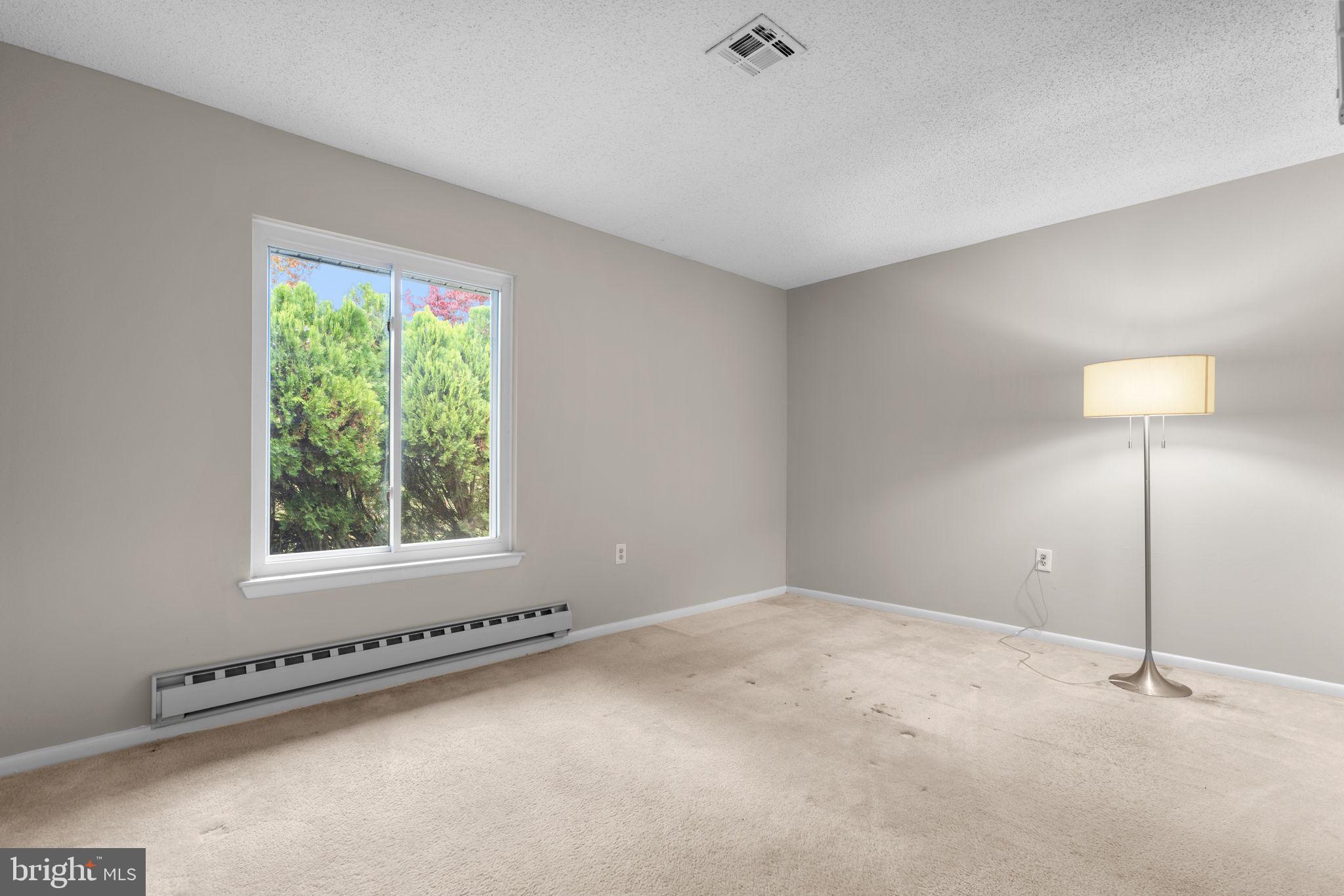3415 Island Creek Court, Unit 131A Silver Spring, MD 20906 - Photo 25 of 32 a view of an empty room with a window