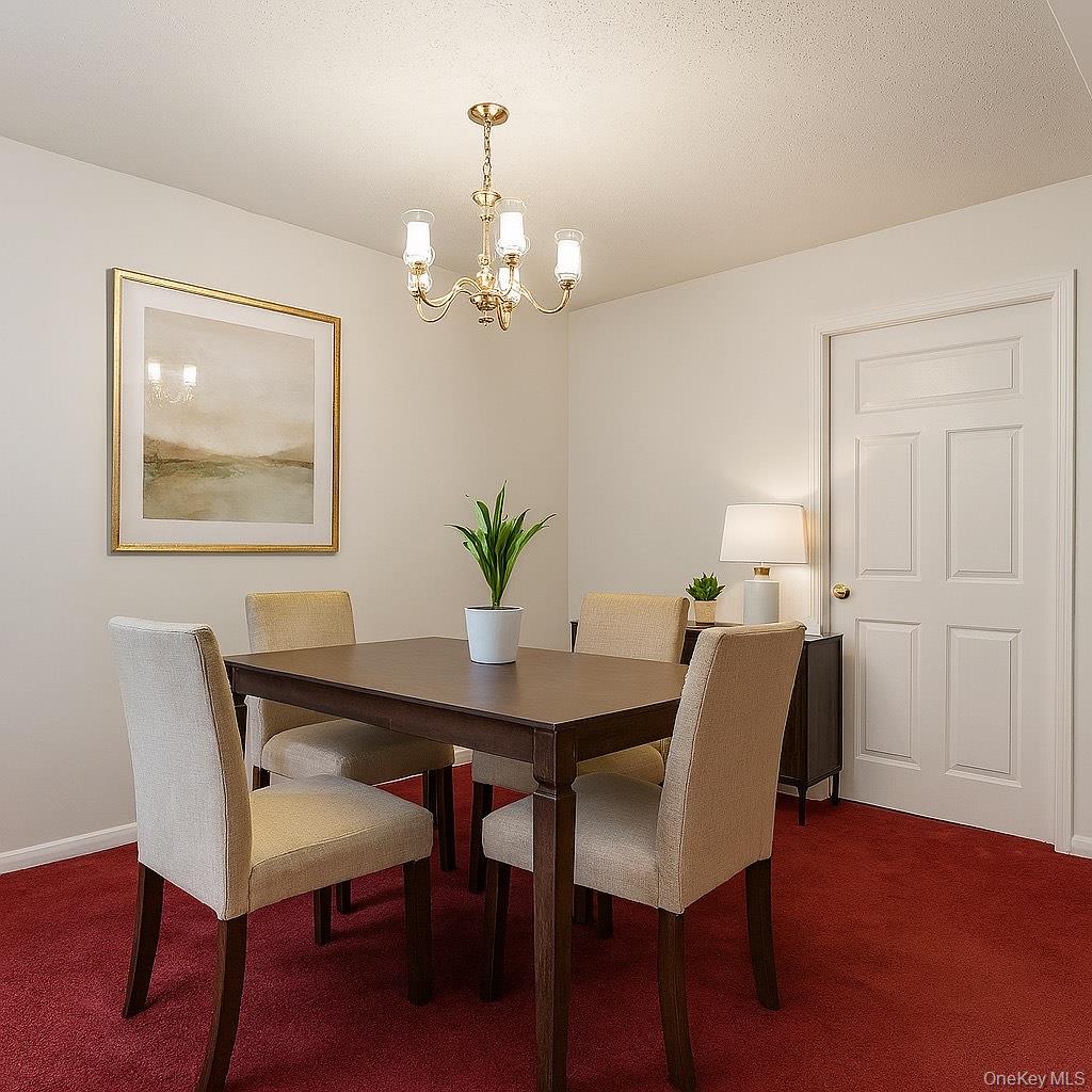 107-04 Guy R Brewer Boulevard, Unit 7A Queens, NY 11433 - Photo 3 of 8 a view of a dining room with furniture and chandelier
