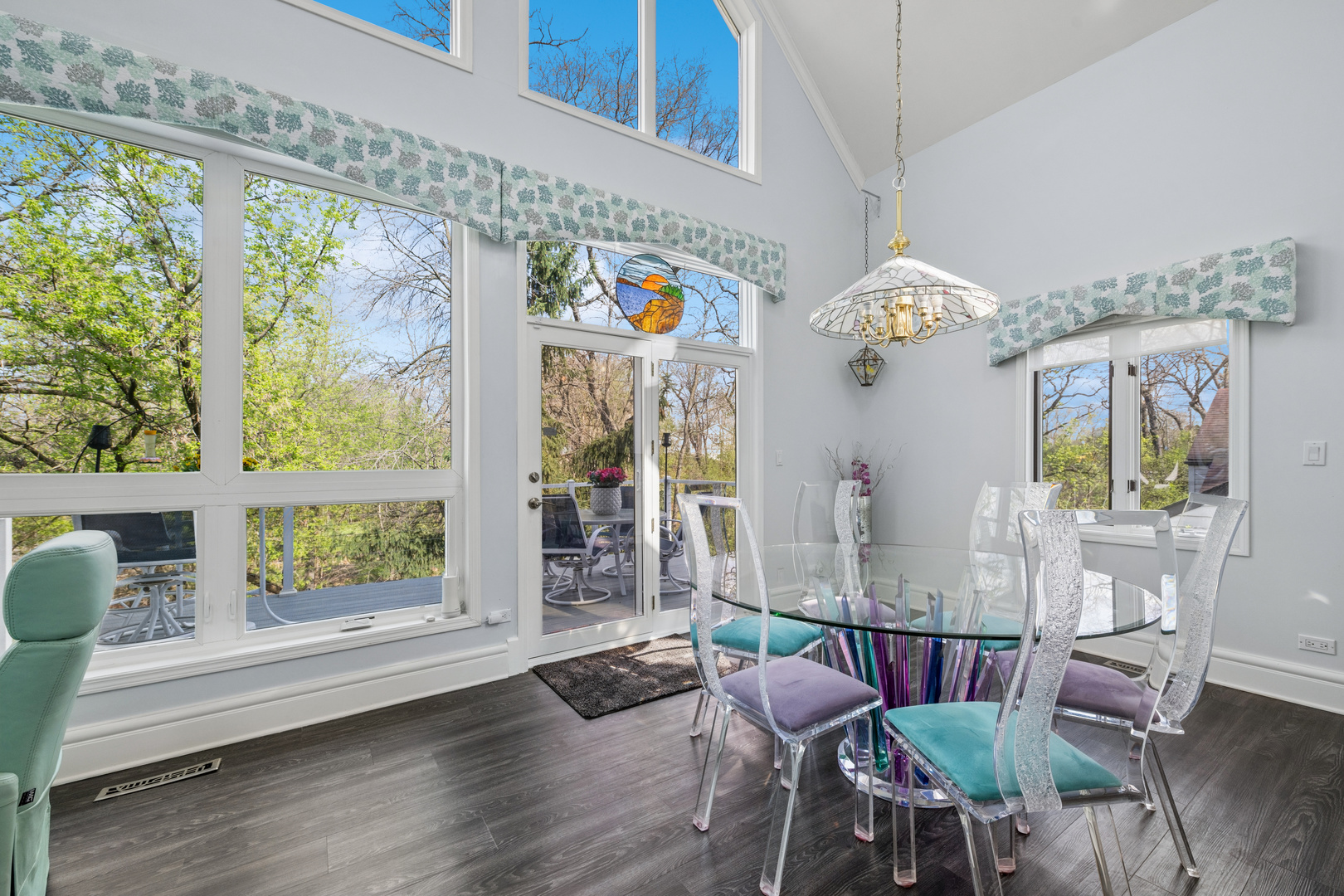 6112 Pleasant View Lane Cary, IL 60013 - Photo 7 of 31 a view of a dining room with furniture a chandelier and wooden floor