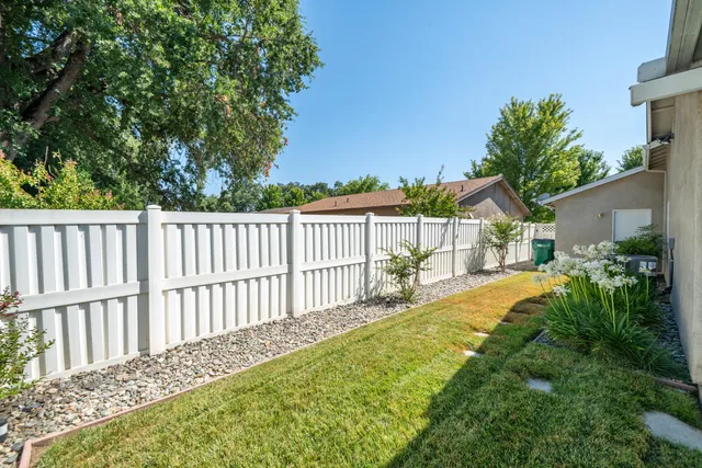 a view of a backyard with potted plants
