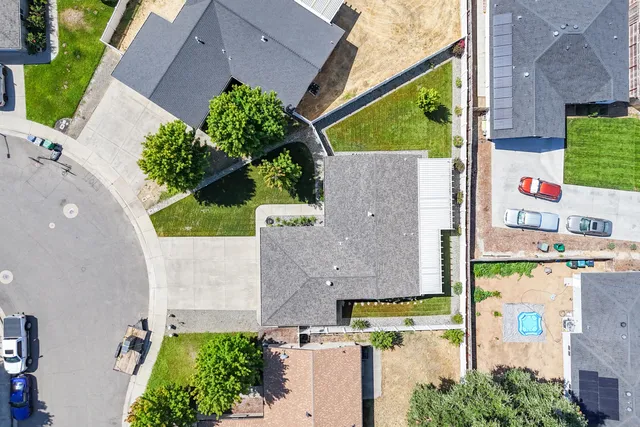 an aerial view of a house with outdoor space