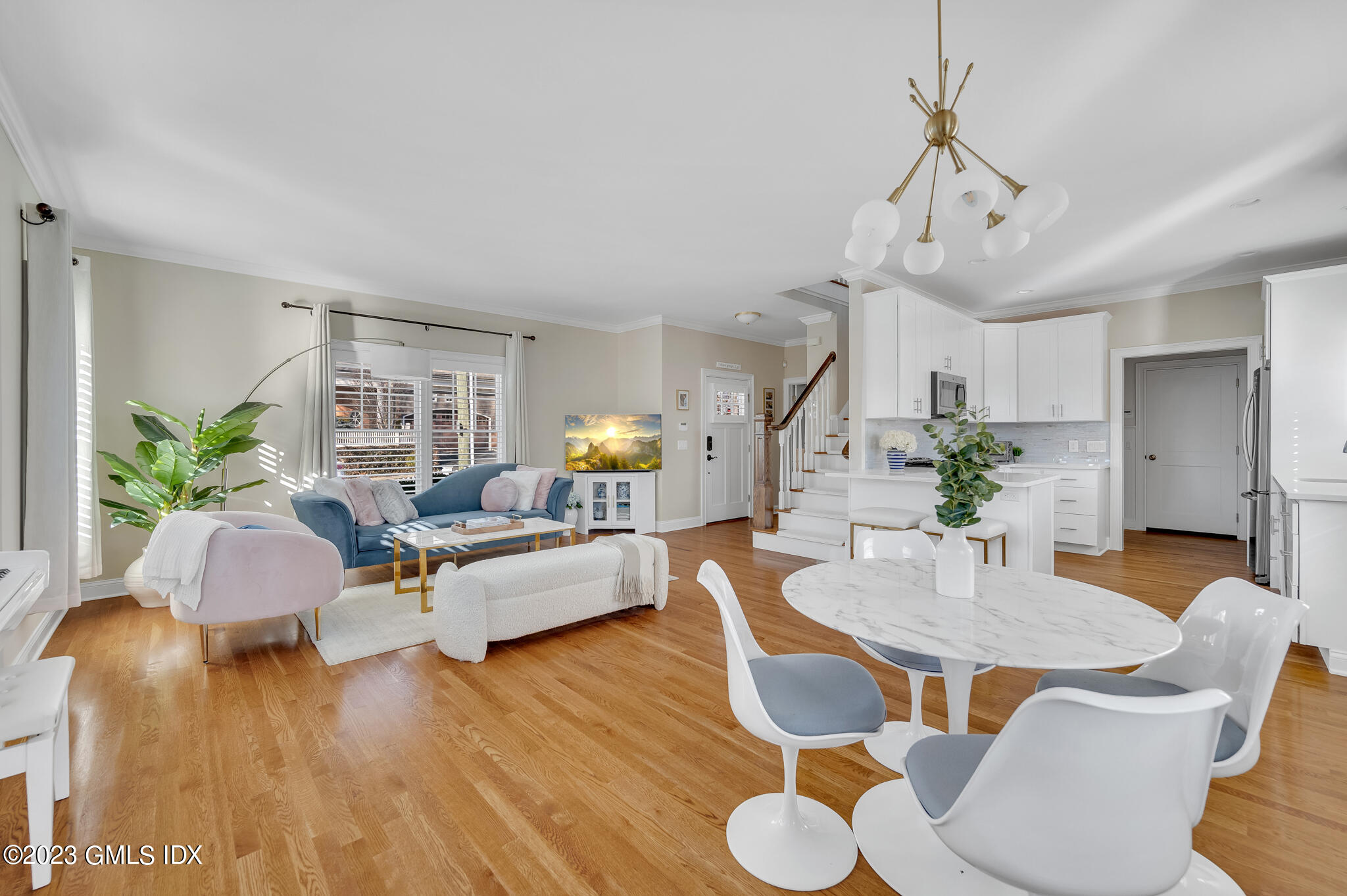 72 Havemeyer Place, Unit B Greenwich, CT 06830 - Photo 1 of 19 a view of livingroom and dining room with furniture wooden floor