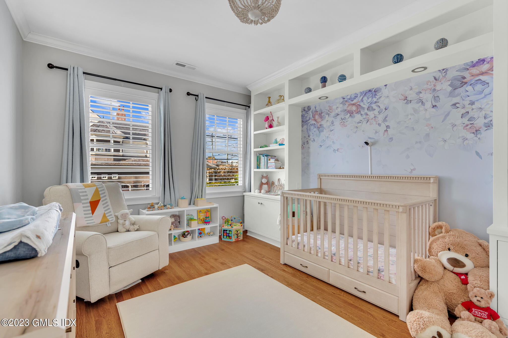 72 Havemeyer Place, Unit B Greenwich, CT 06830 - Photo 11 of 19 a bedroom with furniture and a large window