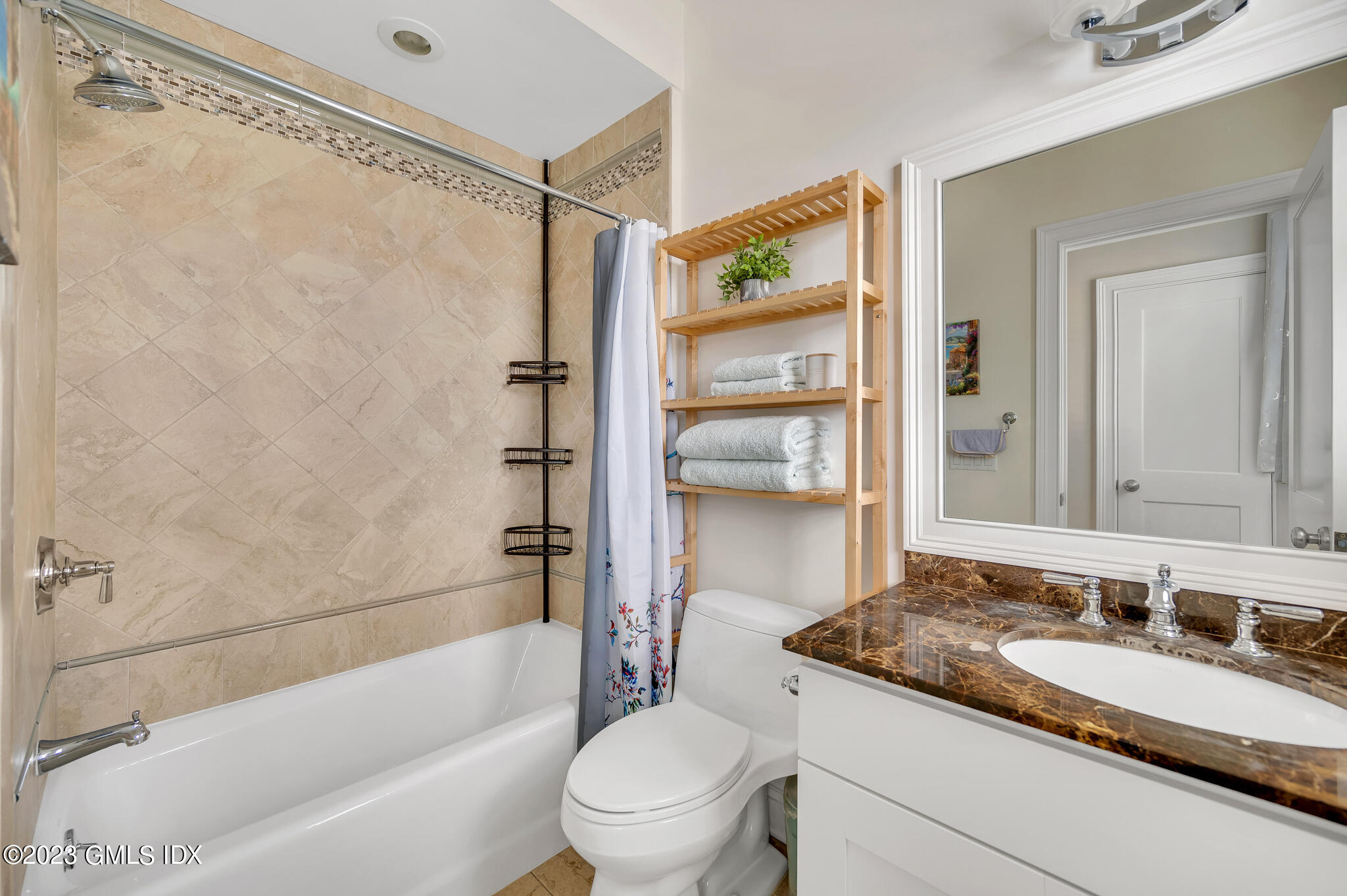 72 Havemeyer Place, Unit B Greenwich, CT 06830 - Photo 12 of 19 a bathroom with a granite countertop sink toilet and shower
