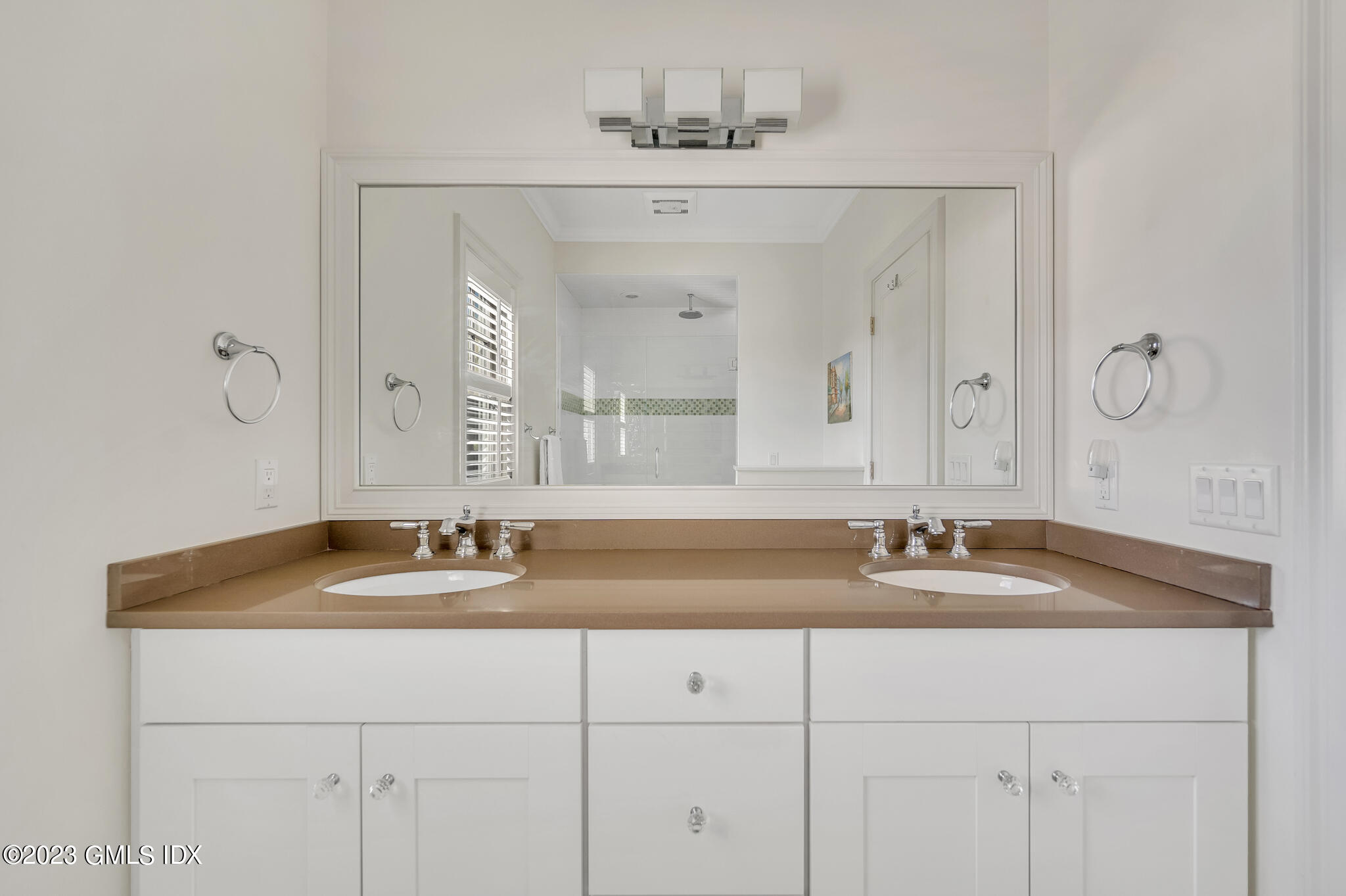 72 Havemeyer Place, Unit B Greenwich, CT 06830 - Photo 9 of 19 a bathroom with double vanity sinks and a mirror