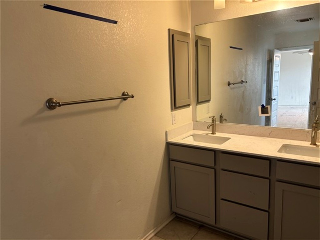 252 Benmyrtle Trail Georgetown, TX 78626 - Photo 13 of 17 a bathroom with a sink and mirror