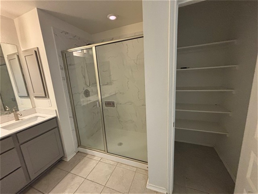 252 Benmyrtle Trail Georgetown, TX 78626 - Photo 14 of 17 a bathroom with a shower and a sink