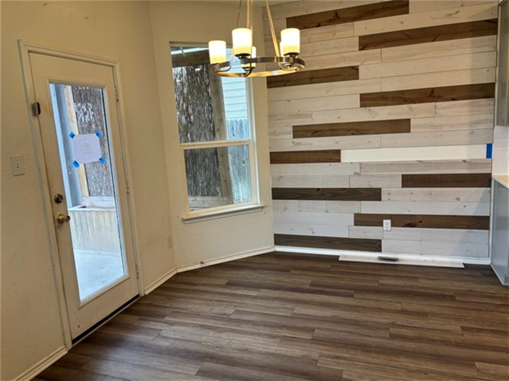 252 Benmyrtle Trail Georgetown, TX 78626 - Photo 3 of 17 a view of an empty room with wooden floor and a window