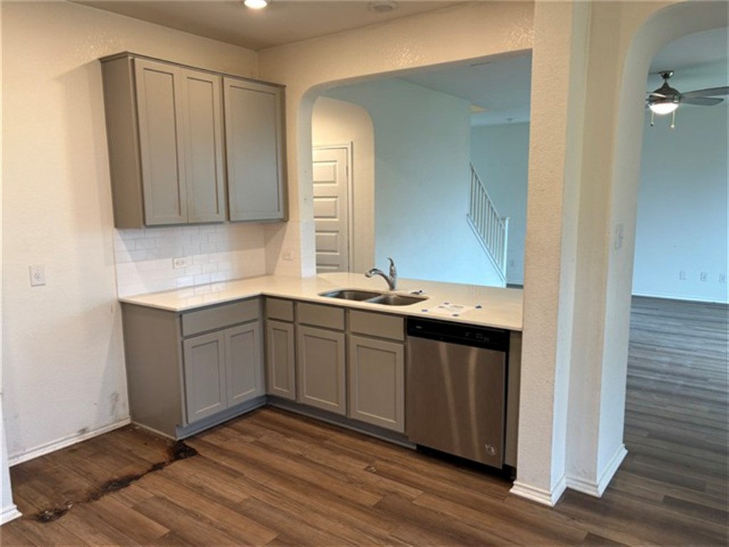 252 Benmyrtle Trail Georgetown, TX 78626 - Photo 4 of 17 a kitchen with a sink and cabinets