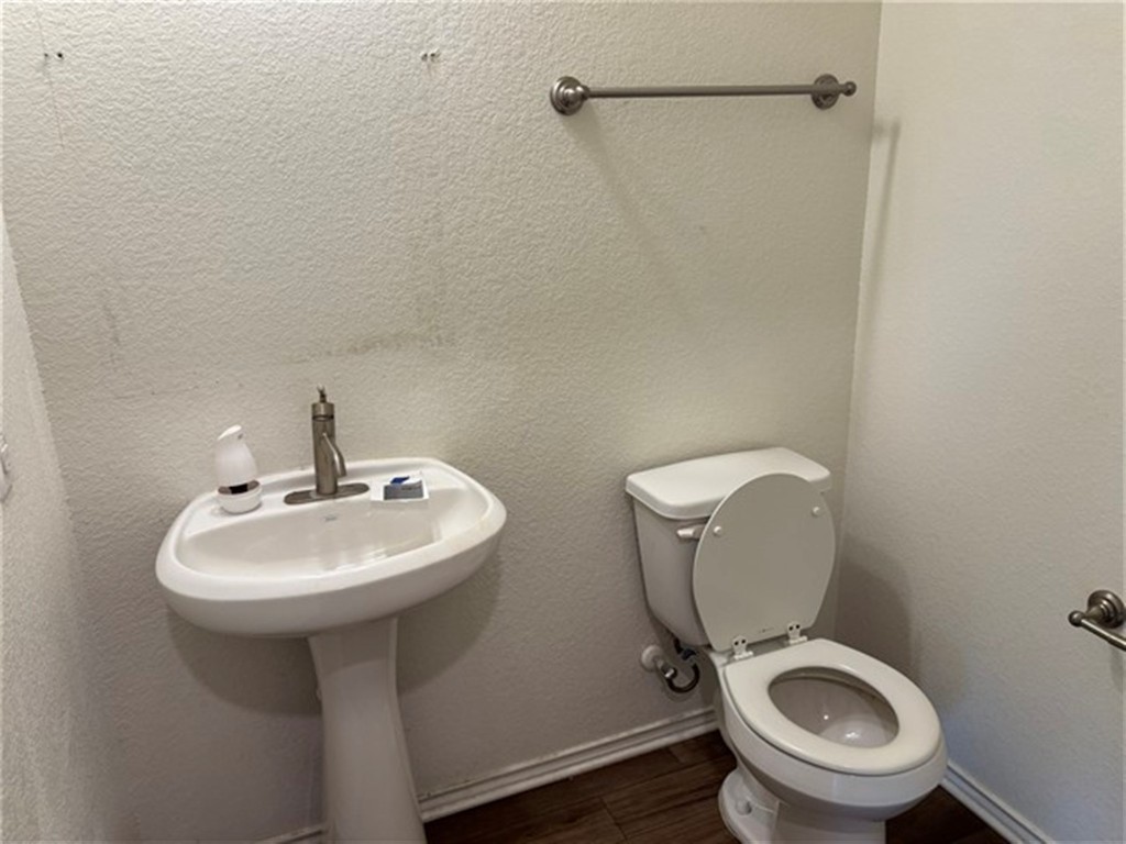 252 Benmyrtle Trail Georgetown, TX 78626 - Photo 6 of 17 a bathroom with a sink mirror and toilet