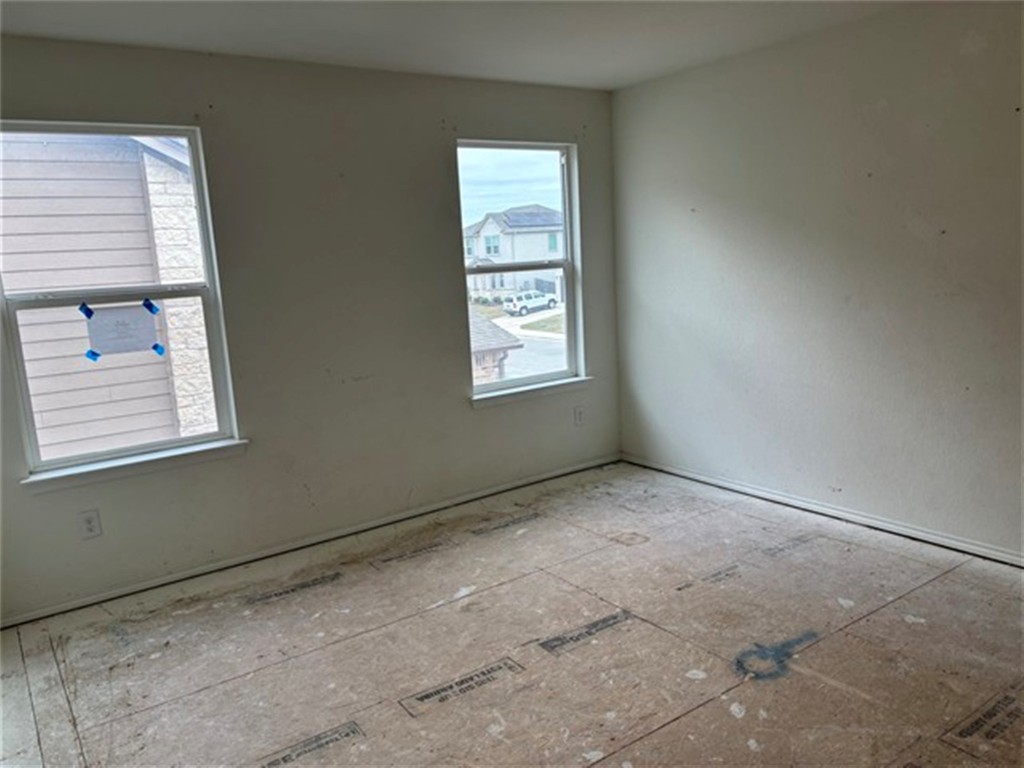 252 Benmyrtle Trail Georgetown, TX 78626 - Photo 9 of 17 an empty room with windows
