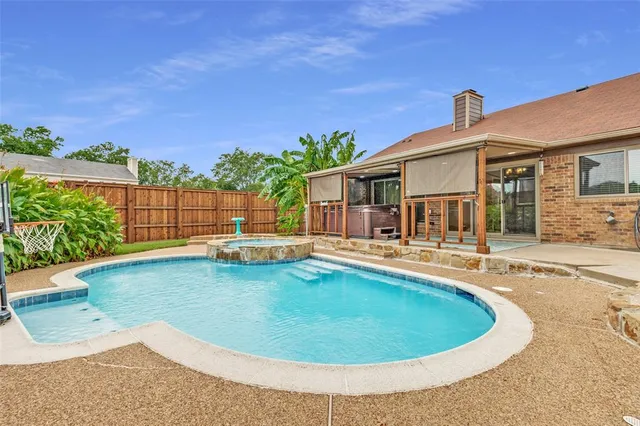 a view of a house with swimming pool and a porch