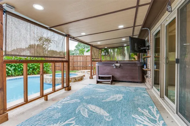 a view of a room with wooden floor and iron stairs