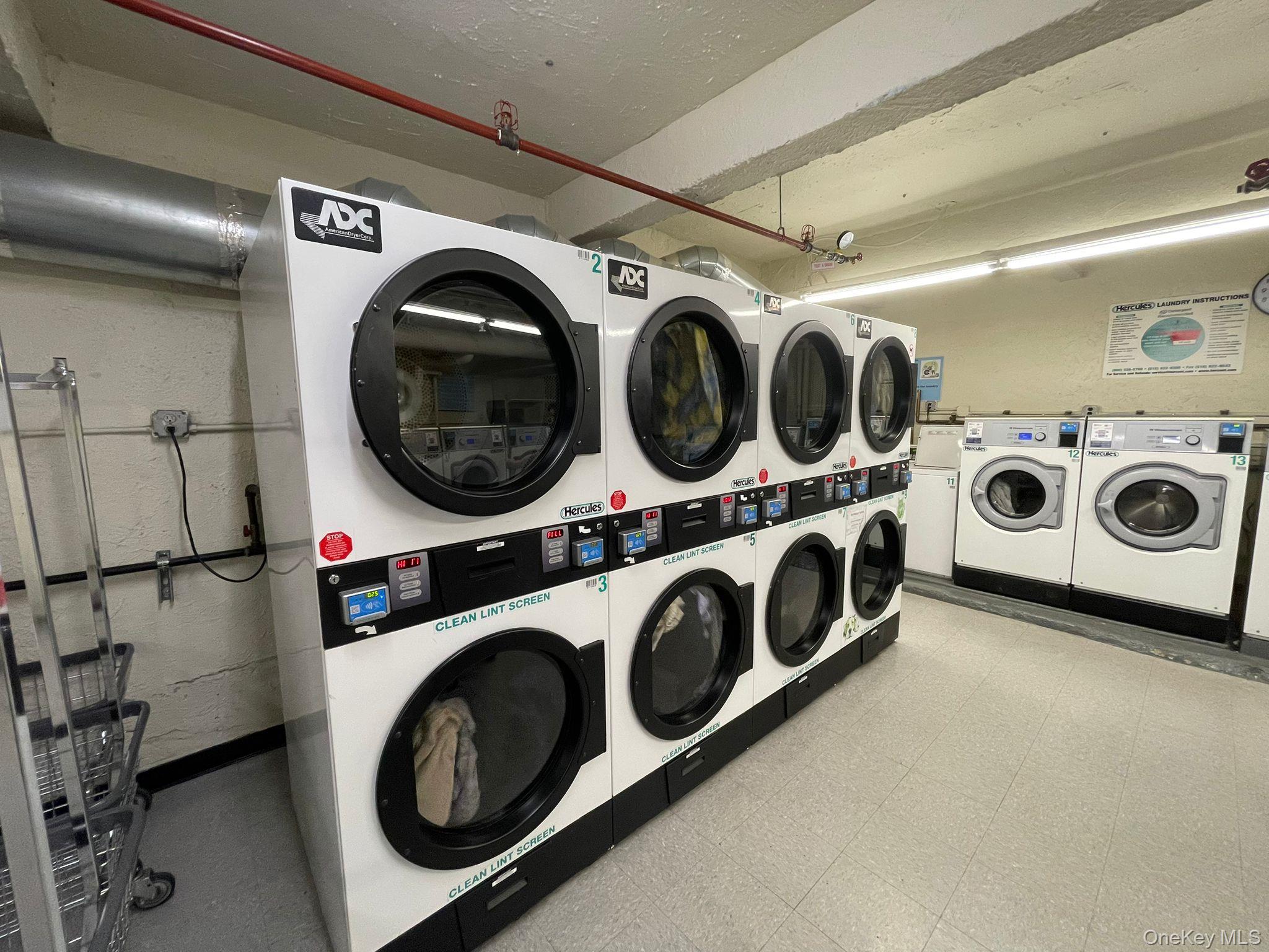 100-11 67th Road, Unit 4 Queens, NY 11375 - Photo 28 of 33 Community laundry room featuring light flooring, stacked washer / drying machine, and washing machine and clothes dryer