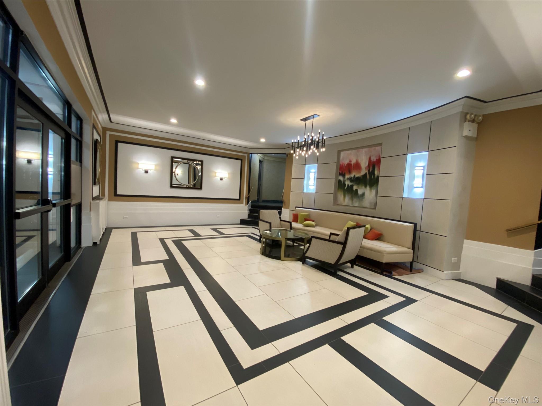 100-11 67th Road, Unit 4 Queens, NY 11375 - Photo 3 of 33 Building lobby with crown molding and recessed lighting