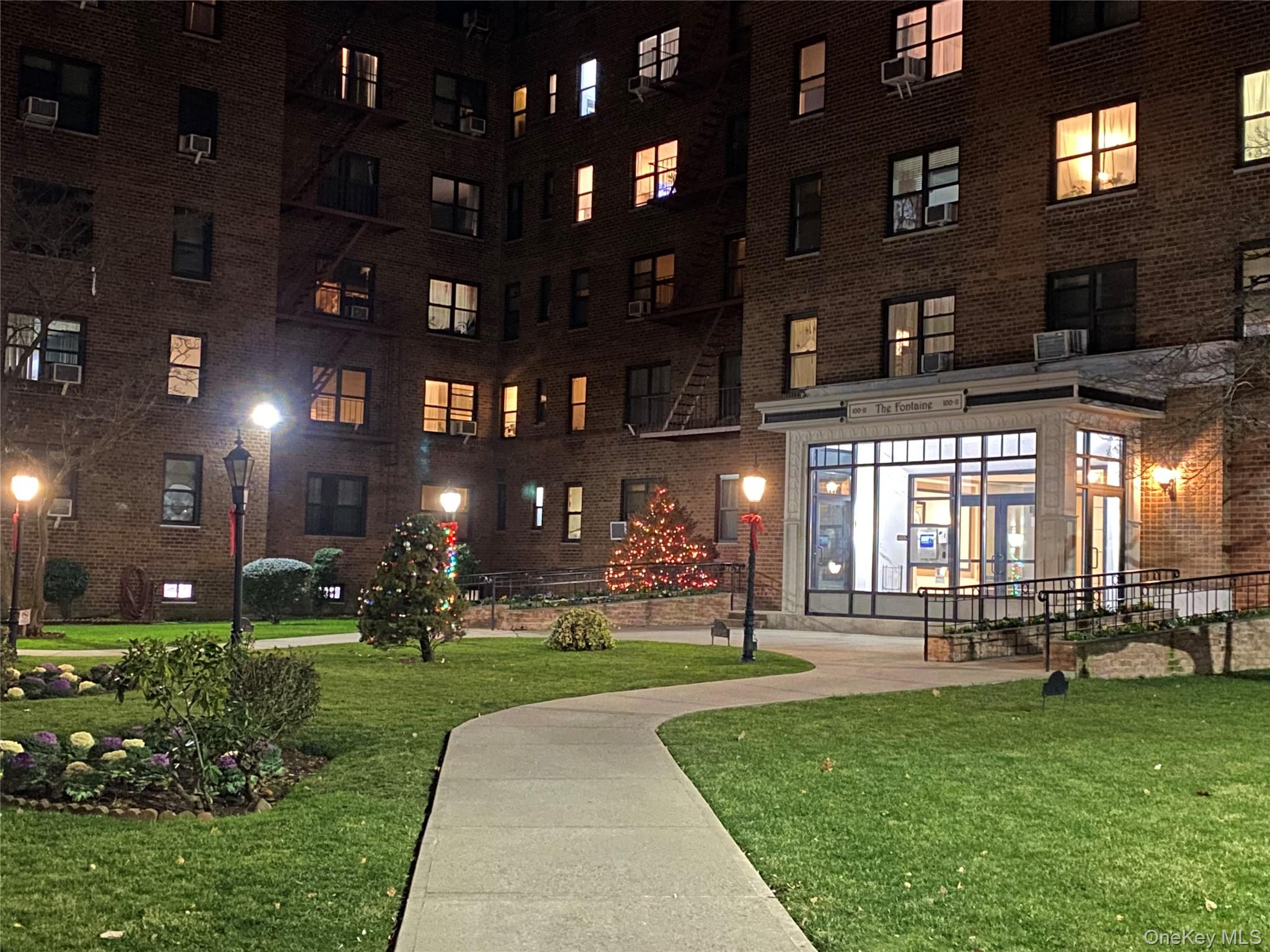 100-11 67th Road, Unit 4 Queens, NY 11375 - Photo 33 of 33 View of community featuring a yard