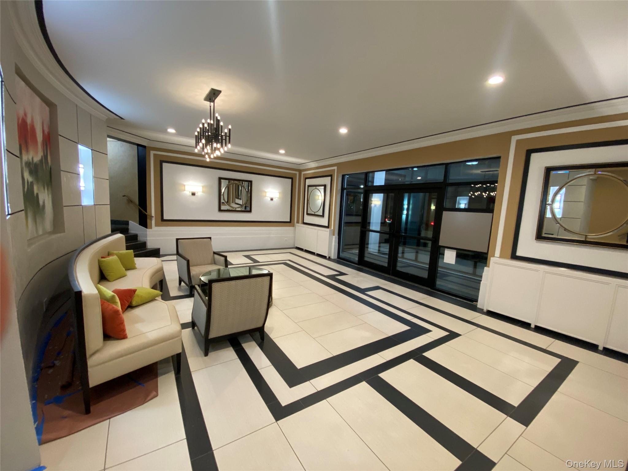 100-11 67th Road, Unit 4 Queens, NY 11375 - Photo 4 of 33 Community lobby featuring a decorative wall, recessed lighting, crown molding, and stairway