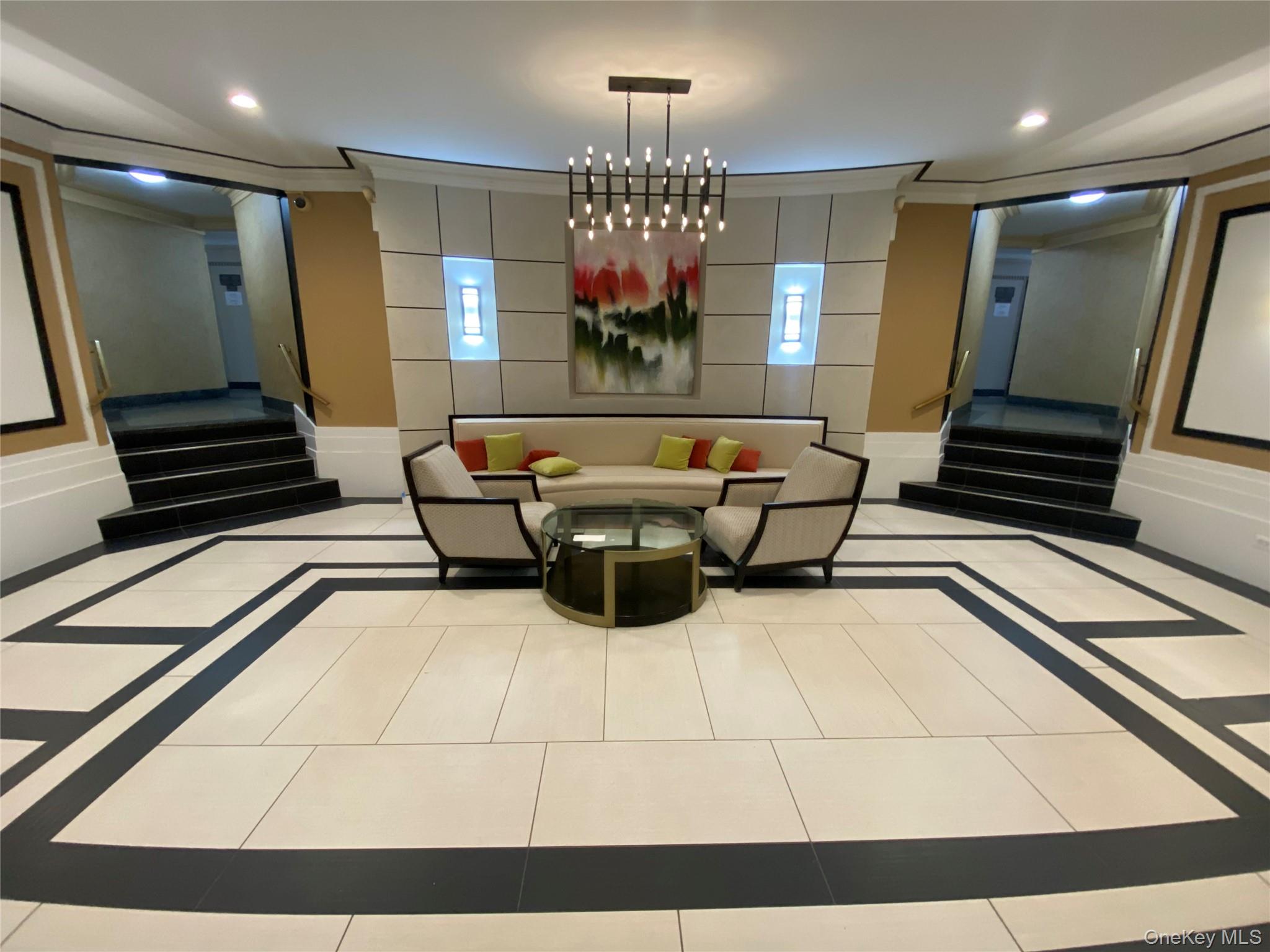 100-11 67th Road, Unit 4 Queens, NY 11375 - Photo 5 of 33 Lobby with stairway, ornamental molding, a decorative wall, and recessed lighting