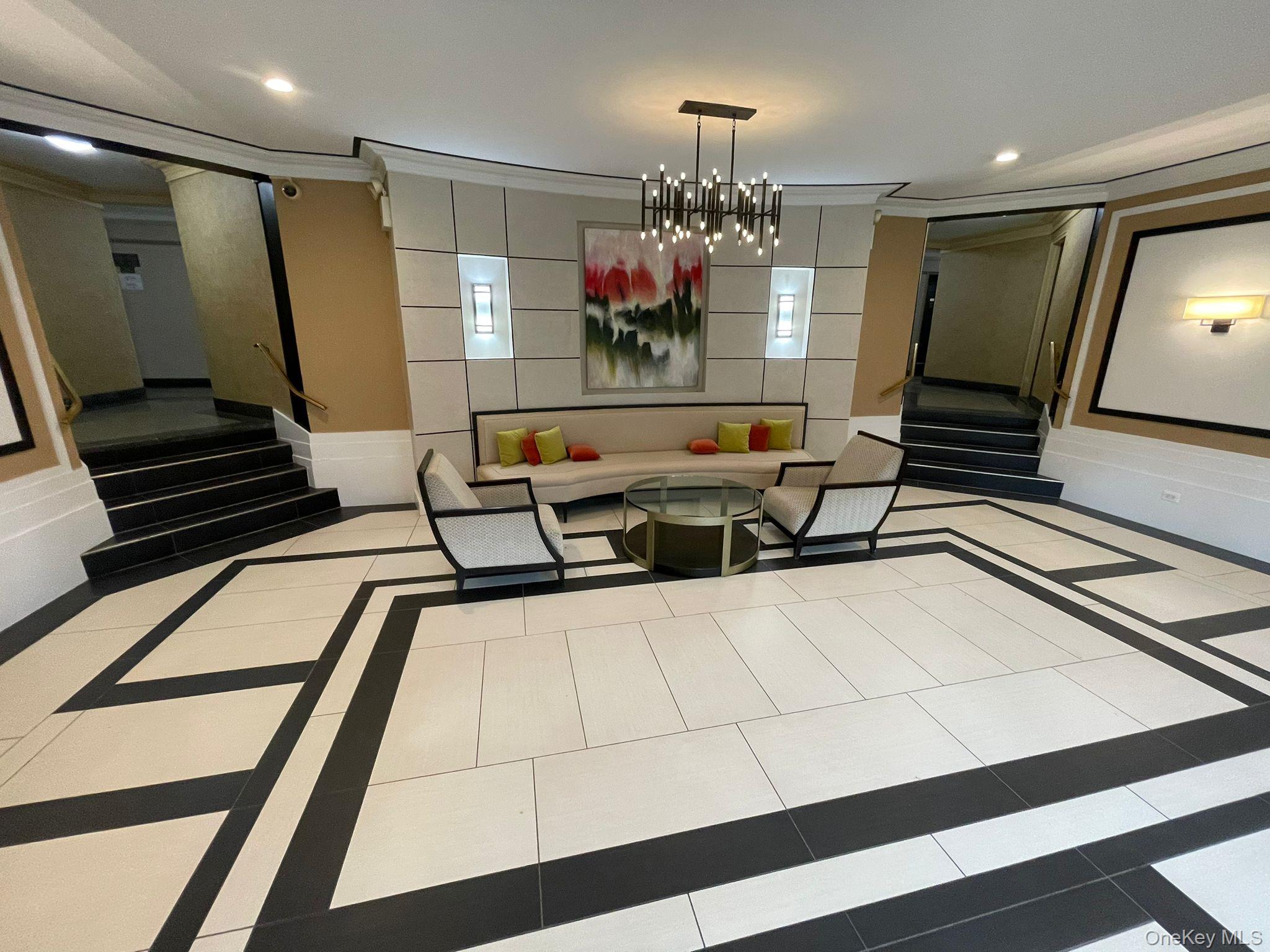 100-11 67th Road, Unit 4 Queens, NY 11375 - Photo 6 of 33 Building lobby with stairs, ornamental molding, and recessed lighting