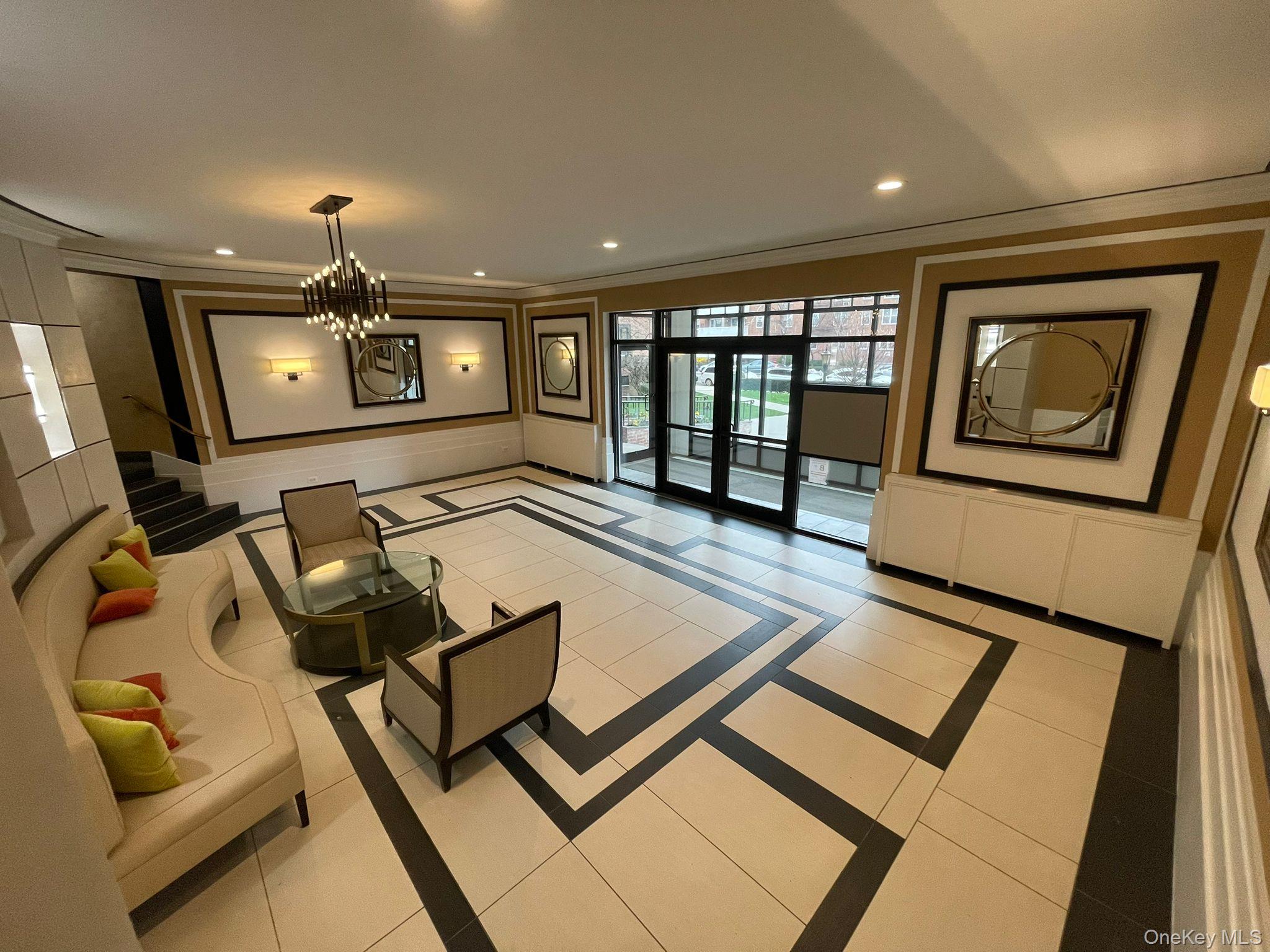 100-11 67th Road, Unit 4 Queens, NY 11375 - Photo 7 of 33 Community lobby featuring ornamental molding and recessed lighting