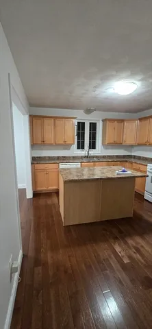 a kitchen with stainless steel appliances granite countertop a sink and cabinets