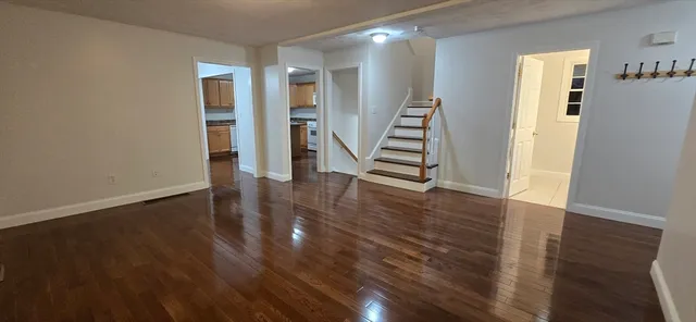 a view of entryway with wooden floor