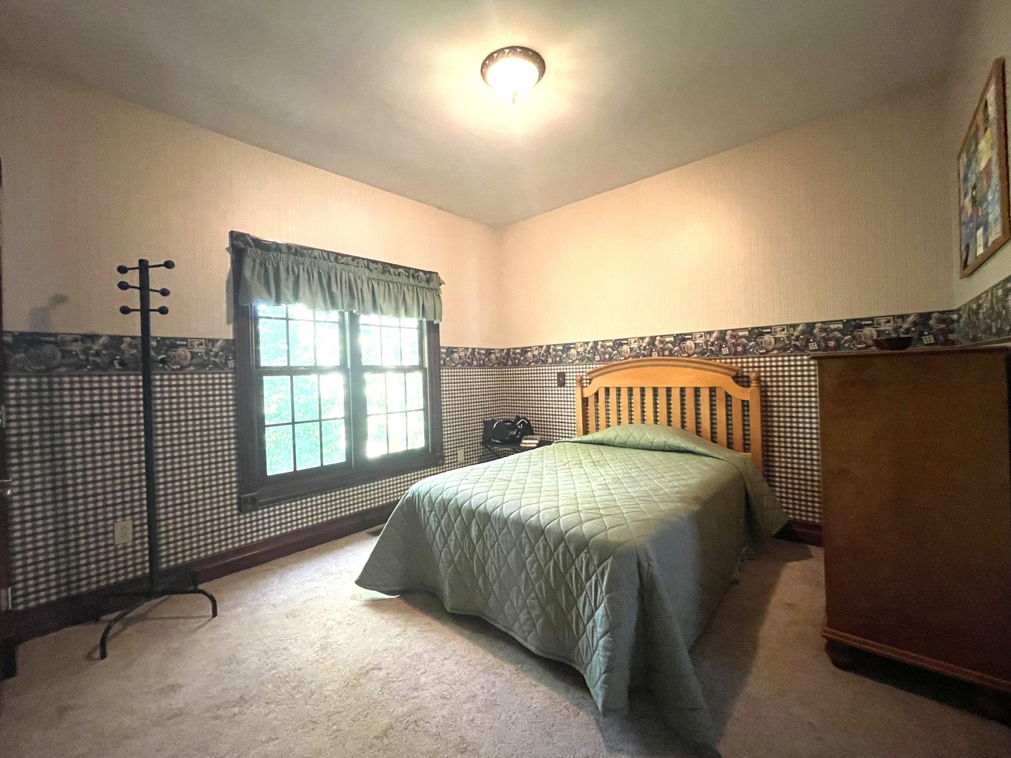 1818 Valley Ridge Lane Dixon, IL 61021 - Photo 33 of 77 a spacious bedroom with a bed and a window