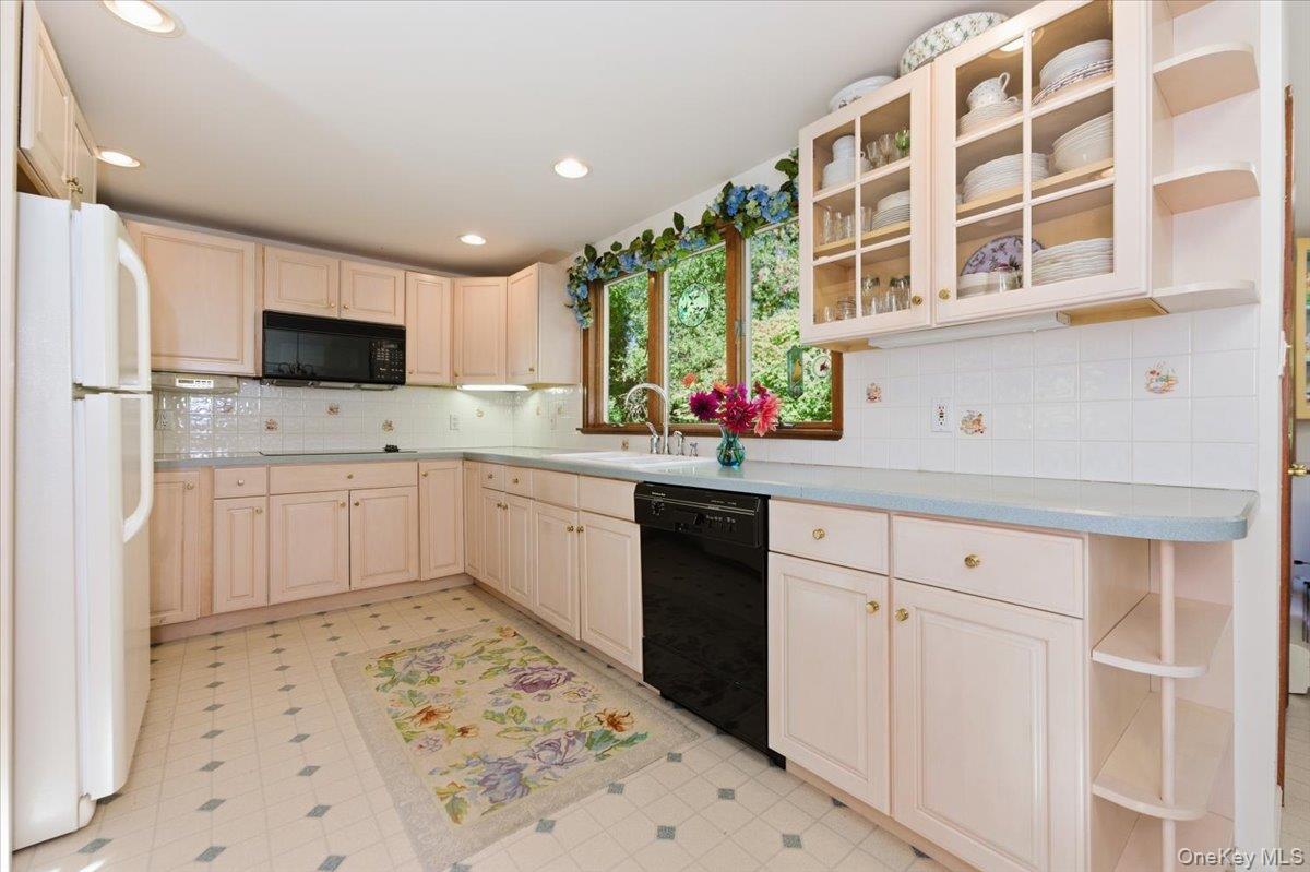 27 Cold Spring Hills Road Huntington, NY 11743 - Photo 13 of 48 a kitchen with a sink cabinets and window