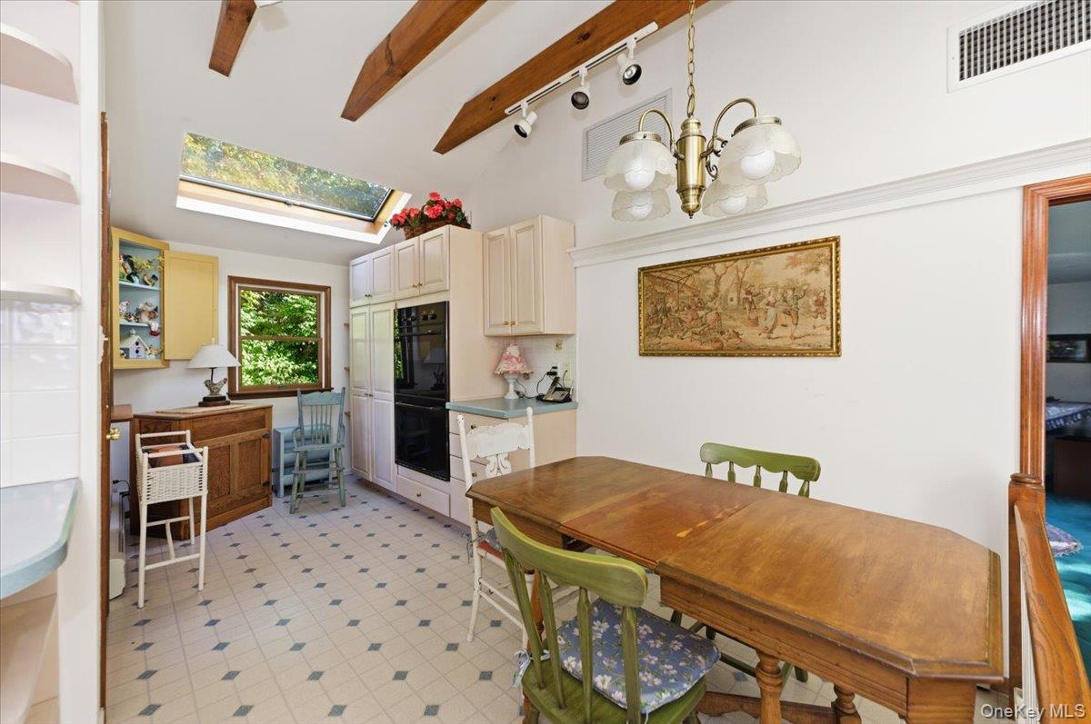 27 Cold Spring Hills Road Huntington, NY 11743 - Photo 14 of 48 a living room with furniture a flat screen tv and a table