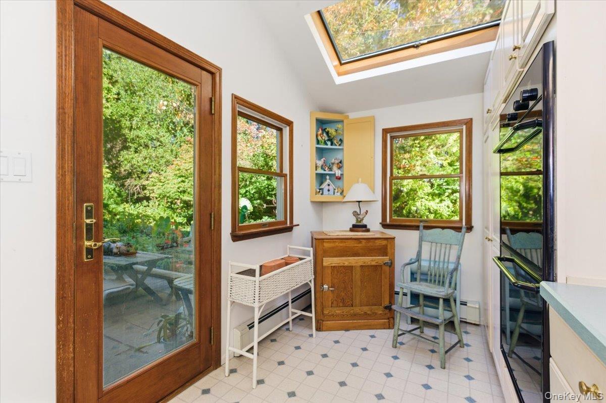 27 Cold Spring Hills Road Huntington, NY 11743 - Photo 15 of 48 a room with furniture a large window and a fireplace