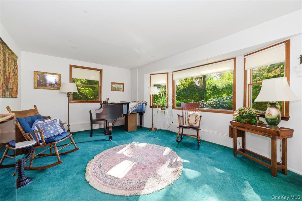 27 Cold Spring Hills Road Huntington, NY 11743 - Photo 17 of 48 a living room with furniture and a large window