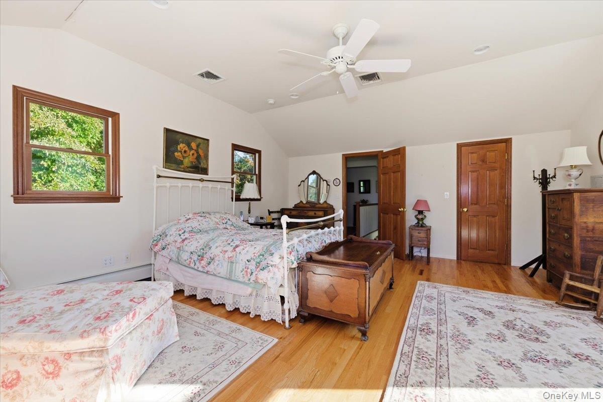 27 Cold Spring Hills Road Huntington, NY 11743 - Photo 20 of 48 a bedroom with a bed and a flat screen tv