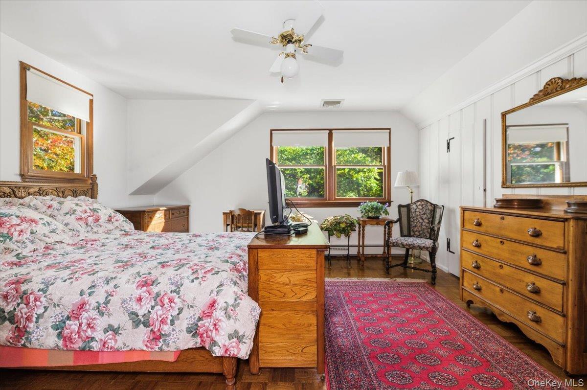 27 Cold Spring Hills Road Huntington, NY 11743 - Photo 22 of 48 a bedroom with a bed and wooden floor