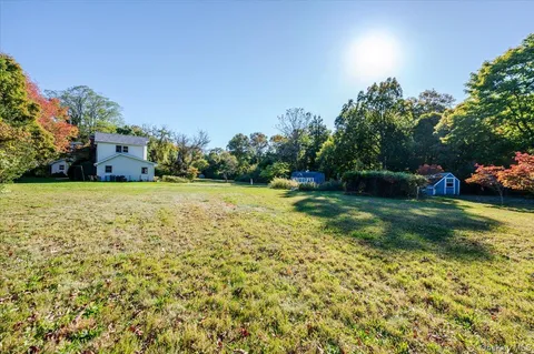 a view of a garden with houses