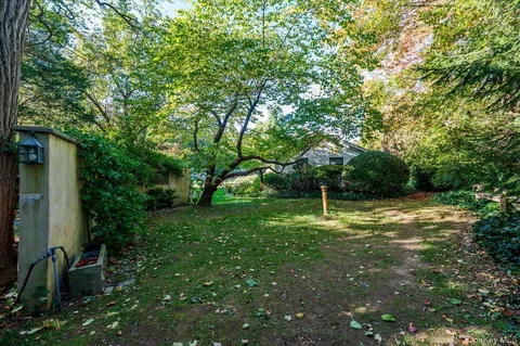 a backyard of a house with lots of green space