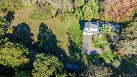 a aerial view of a house with a yard