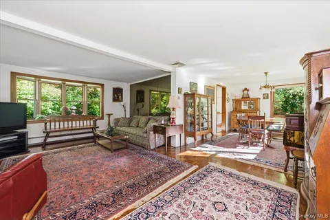a living room with furniture and a rug